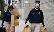 Members of the NYPD Crime Scene Unit collect evidence inside an apartment complex near Dav...
