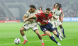 Ismaelo Ganiou of RC Lens and Olivier Giroud of Lille compete during the French L1 footbal...