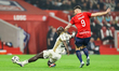 Malang Sarr of RC Lens (left) and Olivier Giroud of Lille during the French Ligue 1 footba...