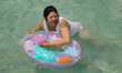 A woman floats in the pool at the Pantitlan Olympic Swimming area in the eastern zone of M...