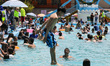 A young person enjoys the Pantitlan Olympic Swimming area in the eastern zone of Mexico Ci...