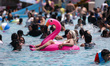 A girl floats in the pool at the Pantitlan Olympic Swimming area in the eastern zone of Me...