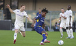 Gift Orban of Hellas Verona FC competes for the ball with Pietro Camuzzo of ACF Fiorentina...