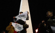 People participate in a torch march in defense of glaciers in Buenos Aires, Argentina, on...