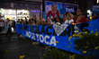 People participate in a torch march in defense of glaciers in Buenos Aires, Argentina, on...