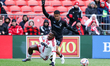 Toronto FC wing back Ritchie Laryea (left) is brought down by Colorado Rapids defender Mig...