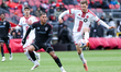 Toronto FC defender Walker Zimmerman #25 controls the ball while watched by Colorado Rapid...
