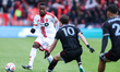 Toronto FC defender Ritchie Laryea #22 passes the ball during a Major League Soccer game b...