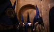 Penitents participate in the Nuestra Senora Santa Maria de la Alhambra brotherhood process...
