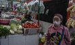Residents crowd the Oro Oro Dowo traditional market to buy food and household supplies in...