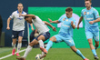 Yuriy Gorshkov (2nd R) of Zenit and Jimmy Marin (2nd L) of Krylia Sovetov vie for the ball...