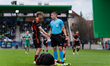 Balint Kiss, a referee, communicates with Jan Hladik of MFK Ruzomberok during the 4th roun...
