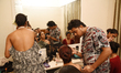 A model has her makeup applied backstage before a new summer collection fashion show hoste...