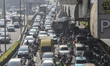 Heavy traffic moves along a main street during the morning rush hour in Jakarta, Indonesia...