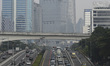Heavy traffic moves along a main street during the morning rush hour in Jakarta, Indonesia...