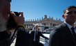 Pope Leo XIV waves to the faithful at the end of the Easter Mass in St. Peter's Square in...