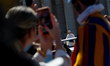 Pope Leo XIV waves to the faithful at the end of the Easter Mass in St. Peter's Square in...