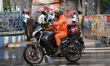An online food delivery person works during the rain in Kolkata, India, on April 5, 2026. 