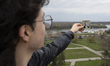 A young man holds a portrait of Russian President Vladimir Putin at Kalemegdan Fortress in...
