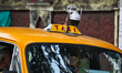 CCTV cameras are seen over a commercial taxi as part of surveillance by the Election Commi...