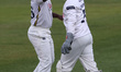 Durham's Kemar Roach celebrates a wicket with Ollie Robinson during the Rothesay County Ch...