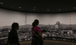 HIROSHIMA, JAPAN - APRIL 5: 
 International and domestic visitors stand before a panorami...