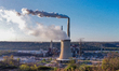 Pollution and steam rise from the stacks of the Miami Fort Power Station situated along th...