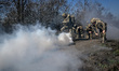 Recruits, supervised by instructors, cover a distance on Day Zero of Basic Military Traini...