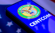 The United States Central Command (CENTCOM) seal is displayed on a smartphone screen in th...