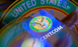 The United States Central Command (CENTCOM) seal is displayed on a smartphone screen in th...