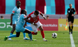 Vinicius Ferreira De Jesus of Naxxar Lions is challenged by N'SA Chrisnovic Isemoli of Gzi...