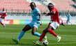 Louis Mvemba Ndualu Pahama of Naxxar Lions is closely confronted by N'SA Chrisnovic Isemol...