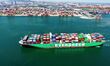 A cargo ship loaded with foreign trade containers enters the port of Qingdao, Shandong, Ch...