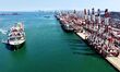 A cargo ship loaded with foreign trade containers is docked at Qingdao Port in Shandong, C...