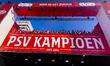 PSV Eindhoven players appear on the balcony during the celebration of their Eredivisie cha...