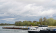 Cargo ships navigate the Rhine near Speyer, Rhineland-Palatinate, Germany, on April 3, 202...