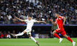 Kylian Mbappe of Real Madrid and Jonathan Tah of Bayern Munich in action during the UEFA C...