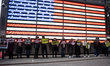 Members and supporters of Rise and Resist march through midtown Manhattan to the U.S. Arme...