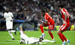 Alphonso Davies of Bayern Munich and Eder Militao of Real Madrid in action during the UEFA...