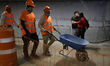 Workers are seen at the Bellas Artes Metro station (Line 2) of the Mexico City Metro syste...