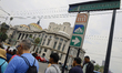Passengers walk outside the Bellas Artes Metro station (Line 2) of the Mexico City Metro s...