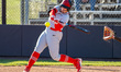 Kelsey Hoekstra of the Rutgers Scarlet Knights hits the ball during an NCAA softball game...