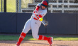 Siera Hoekstra of the Rutgers Scarlet Knights hits the ball during an NCAA softball game a...
