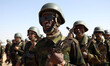 Sahrawi soldiers march during a parade celebrating the 50th anniversary of the proclamatio...