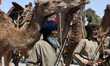 Sahrawi soldiers march during a parade celebrating the 50th anniversary of the proclamatio...