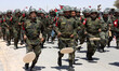 Sahrawi soldiers march during a parade celebrating the 50th anniversary of the proclamatio...