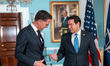 NATO Secretary General Mark Rutte (left) gestures with a double thumbs-up during a photo o...