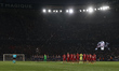 Players, officials, and fans observe a minute of applause in memory of Mircea Lucescu duri...