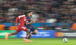 Warren Zaire-Emery of Paris Saint-Germain moves with the ball as Jeremie Frimpong of Liver...