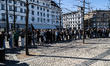 People stand in a queue during a campaign event where Lars Lokke Rasmussen, political lead...